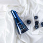 LILIXIR Ageless Rejuvenating Night Serum, a blue serum bottle with blueberries on a white fabric background