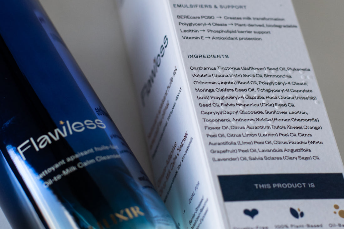 Close-up of a skincare product bottle labeled Flawless with a white product information card showing ingredients and emulsifiers, photographed on a clean white background.