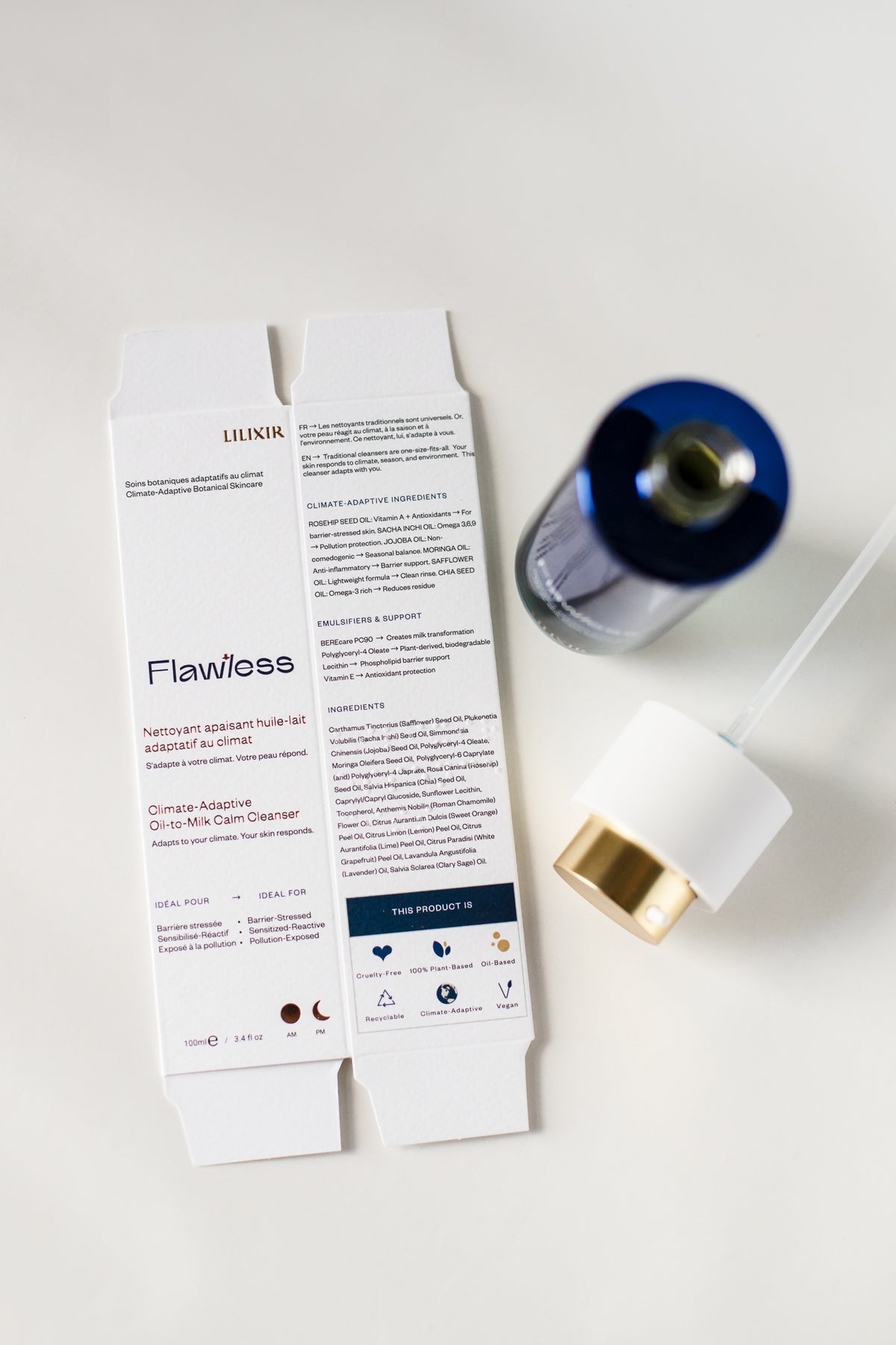 LINIK Flawless face cleanser set shown with its white outer carton packaging and a blue-and-gold serum bottle on a clean white background.