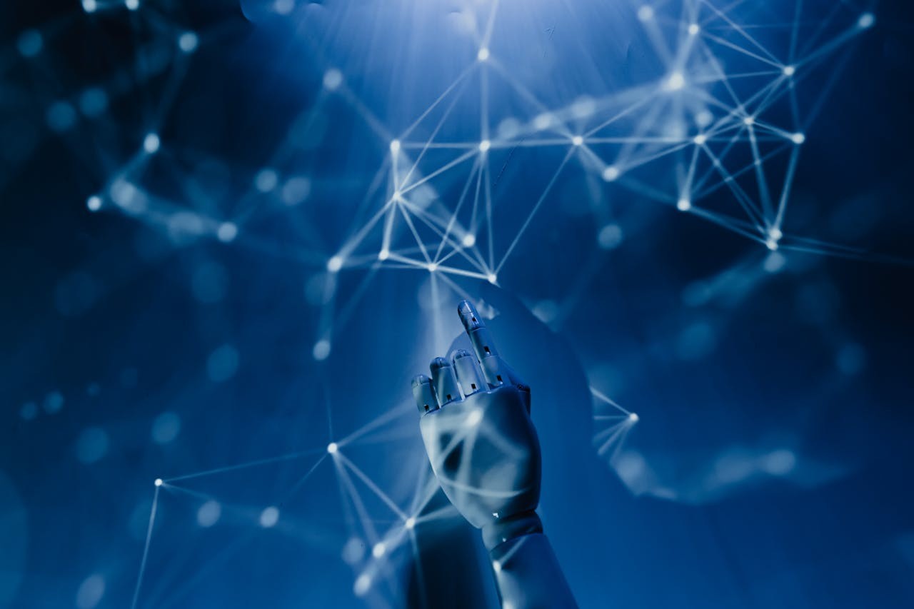 Robot hand interacting with a network of dots and lines on a blue background for LILIXIR AI Masterclass