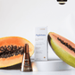 LILIXIR Ageless rejuvenating day serum, skincare product with a halved papaya on a white background