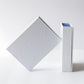 Two white boxes of lilixir gua sha on a light gray background