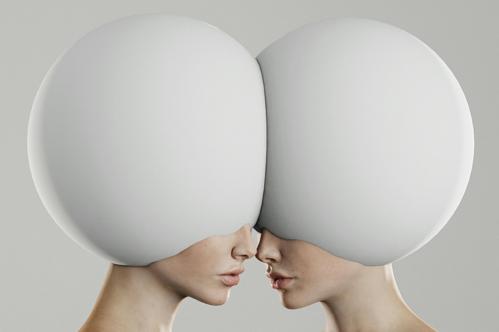 Two faces with large white spherical heads facing each other on a light gray background